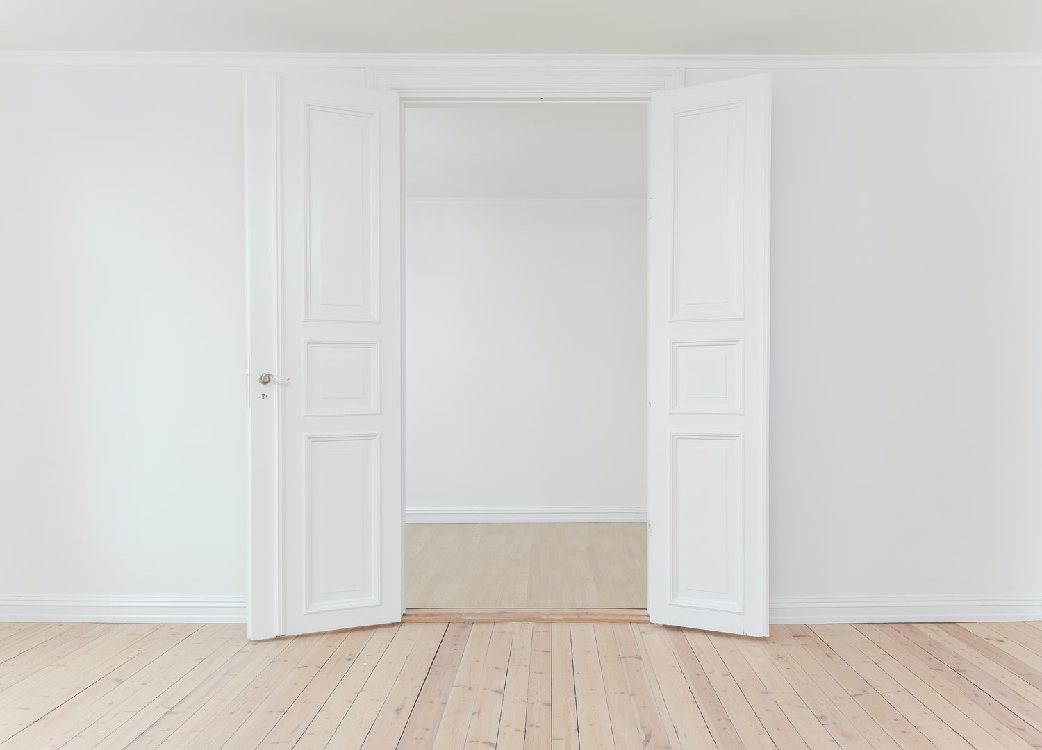 painted white room with double doors